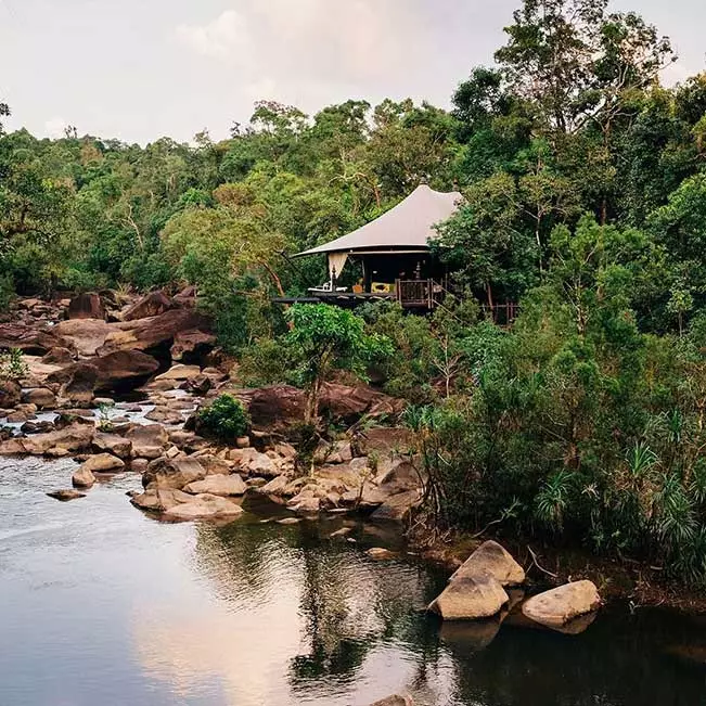 The rainforest-cloaked Cardamom Mountains are Cambodia’s best-kept secret. Elevate your experience with a stay in a safari-style suite at Shinta Mani Wild, an ultra-luxe tented camp inside an 865-acre private nature reserve. 